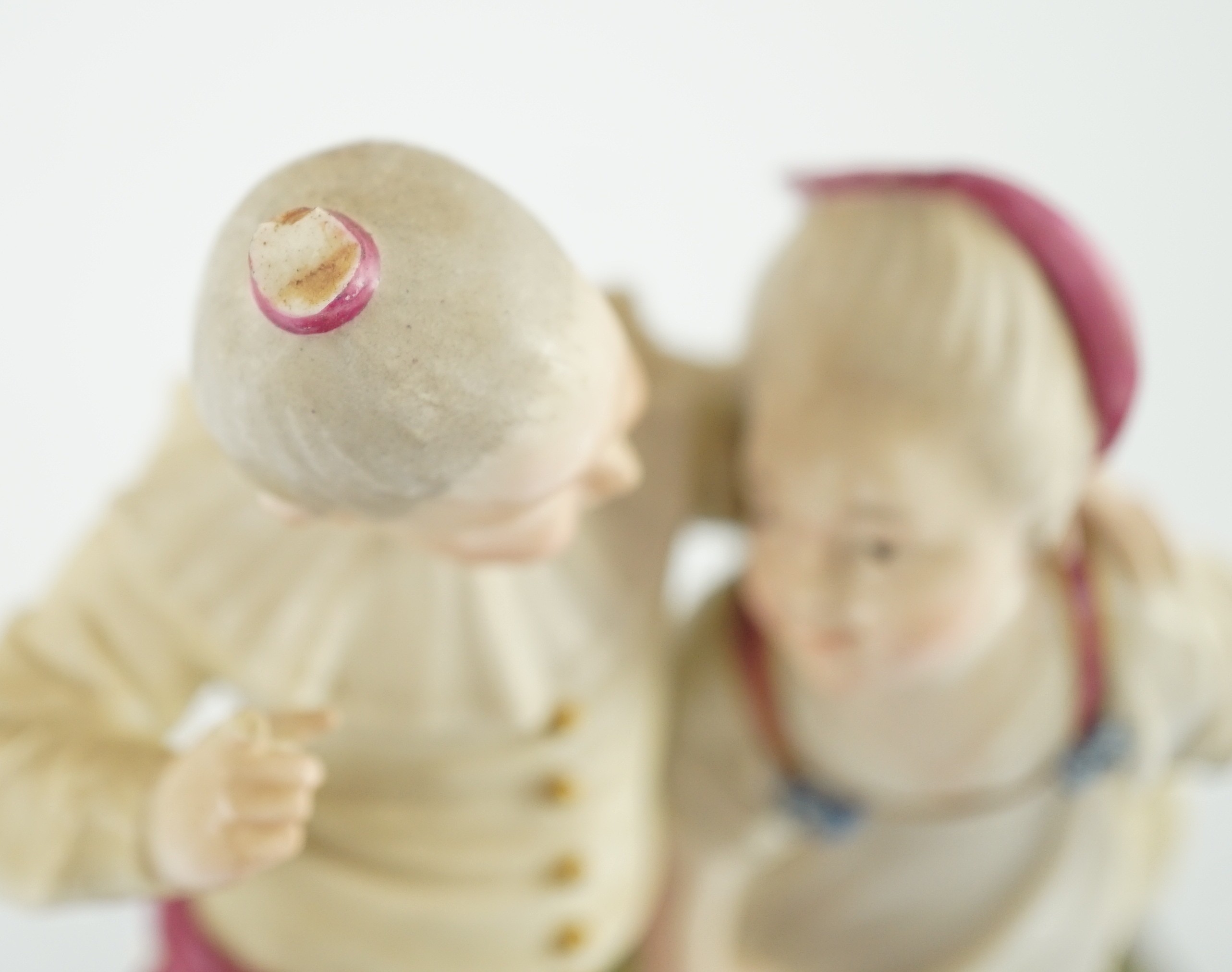 A Höchst porcelain group by Melchior, modelled as a boy and girl wearing fancy dress, c.1770, 16.5cm high, small losses, Provenance - purchased from Winifred Williams, Eastbourne/London before 1970.